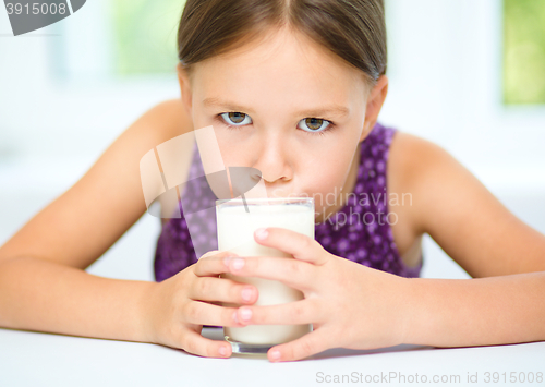 Image of Little girl with a glass of milk