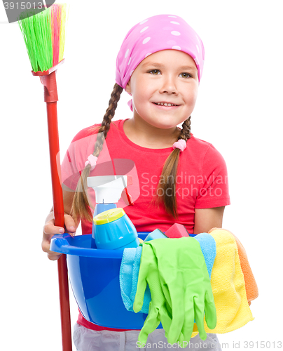 Image of Young girl is dressed as a cleaning maid