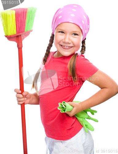 Image of Young girl is dressed as a cleaning maid