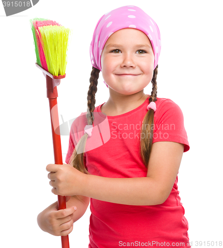 Image of Young girl is dressed as a cleaning maid