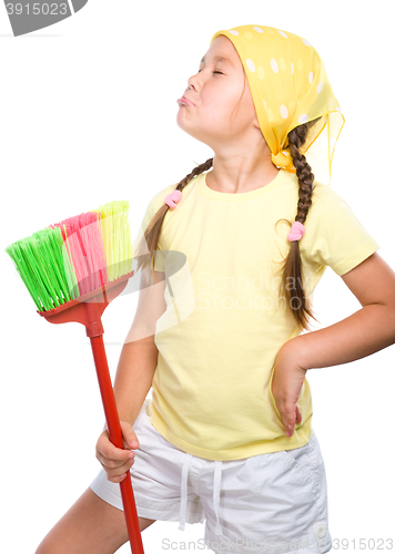 Image of Young girl is dressed as a cleaning maid