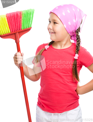 Image of Young girl is dressed as a cleaning maid