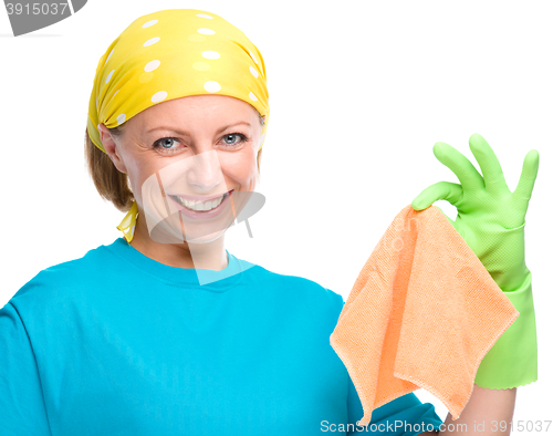 Image of Young woman holding cleaning rag