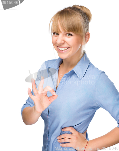 Image of Woman is showing OK sign