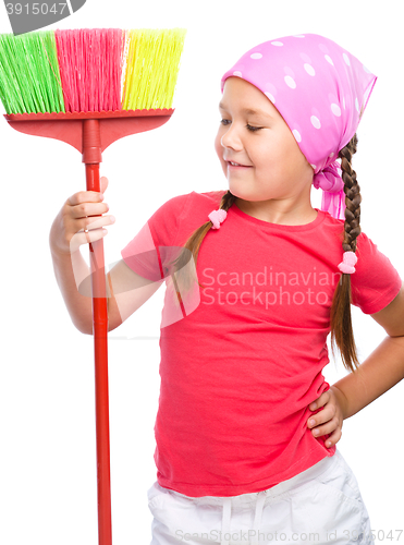 Image of Young girl is dressed as a cleaning maid