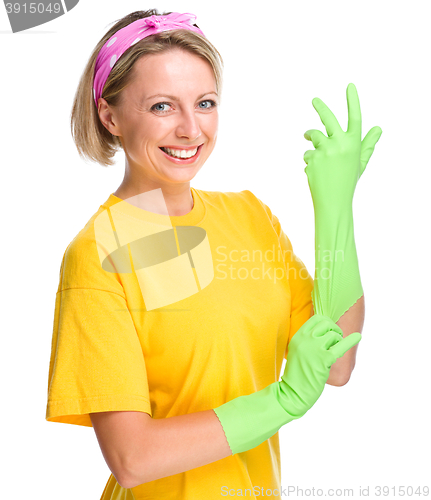 Image of Young woman as a cleaning maid