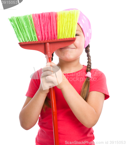 Image of Young girl is dressed as a cleaning maid