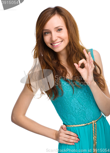 Image of Woman is showing OK sign