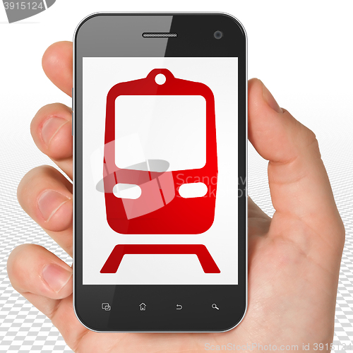 Image of Tourism concept: Hand Holding Smartphone with Train on display