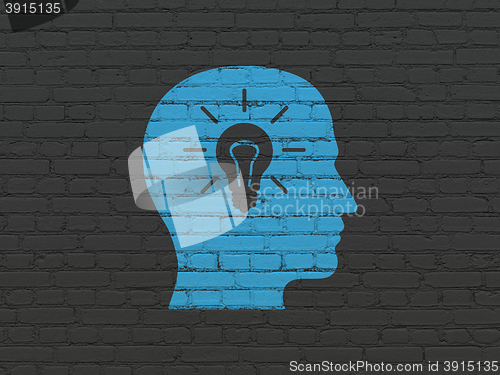 Image of Business concept: Head With Light Bulb on wall background