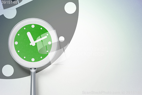 Image of Time concept:  Clock with optical glass on digital background