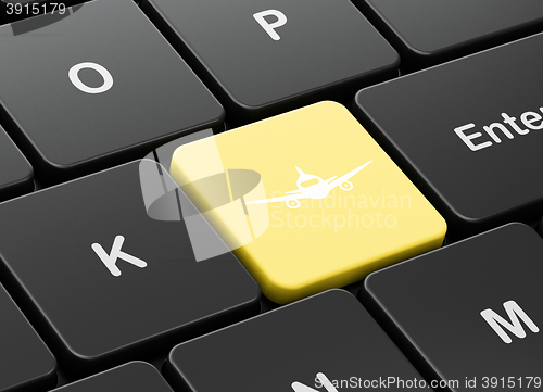 Image of Tourism concept: Aircraft on computer keyboard background