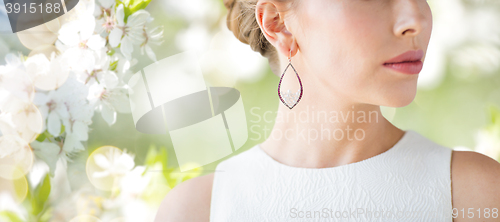 Image of close up of beautiful woman face with earring