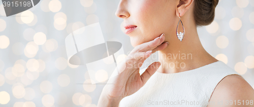 Image of close up of beautiful woman face with earring