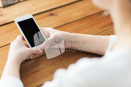 Image of close up of woman texting on smartphone