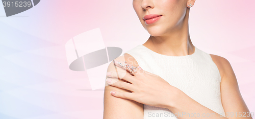 Image of close up of beautiful woman with ring and earring