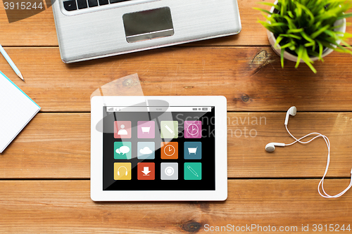 Image of close up of tablet pc computer on wooden table