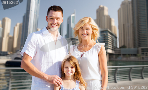 Image of happy family over dubai city street background