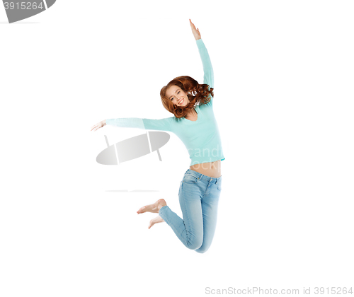 Image of smiling young woman jumping in air