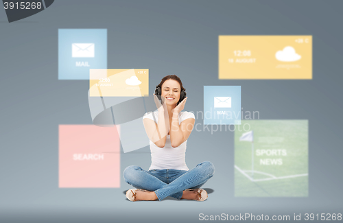 Image of smiling young woman or teen girl in headphones