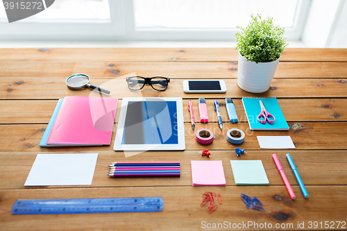 Image of close up of school supplies and tablet pc