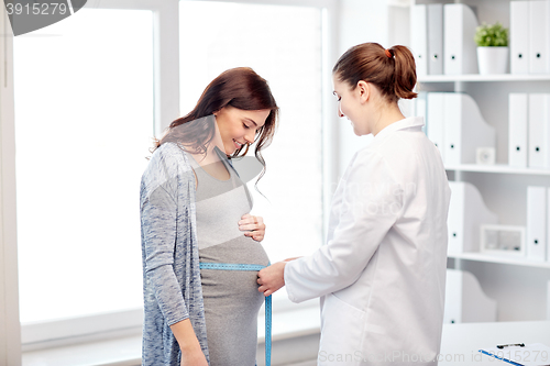 Image of gynecologist doctor and pregnant woman at hospital