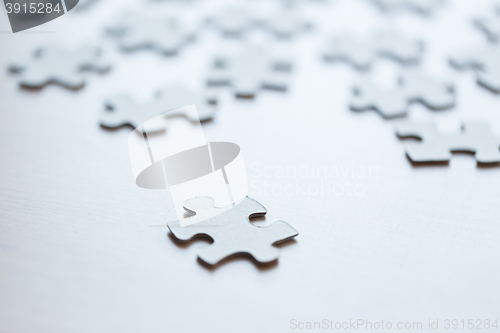 Image of close up of puzzle pieces on table