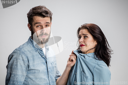 Image of The young couple with different emotions during conflict