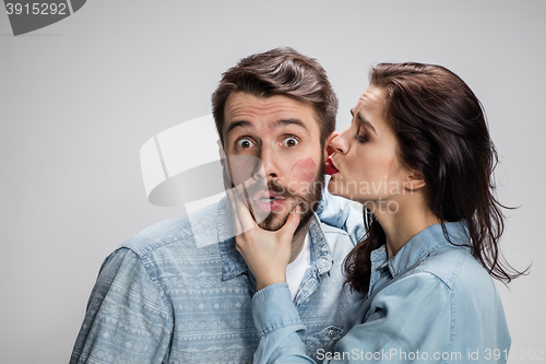 Image of Portrait of happy couple on gray background