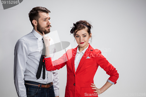 Image of The business man and woman communicating on a gray background