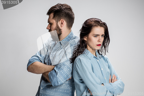 Image of The young couple with different emotions during conflict