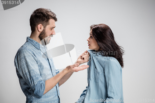 Image of The young couple with different emotions during conflict