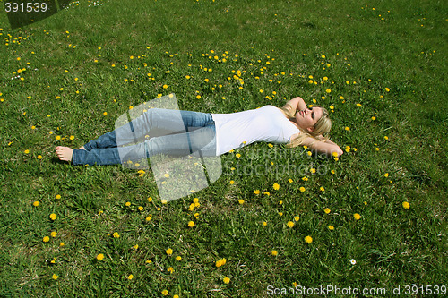 Image of Woman lying on grass