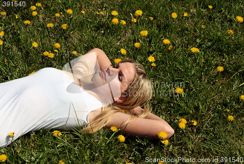 Image of Woman lying on grass