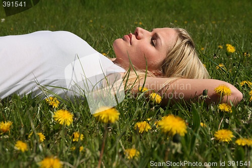 Image of Woman lying on grass