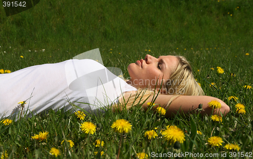 Image of Woman lying on grass