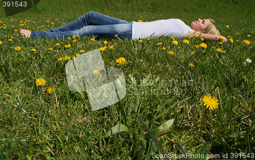 Image of Woman lying on grass