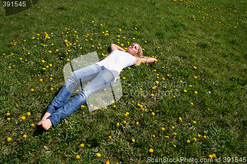 Image of Woman lying on grass