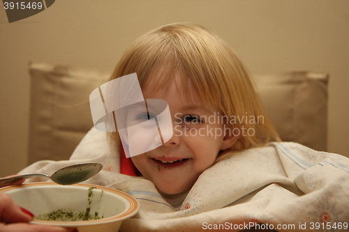 Image of Young girl eating