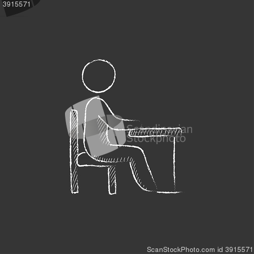Image of Student sitting on chair at the desk. Drawn in chalk icon.