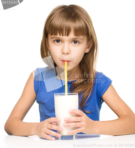 Image of Cute little girl with a glass of milk