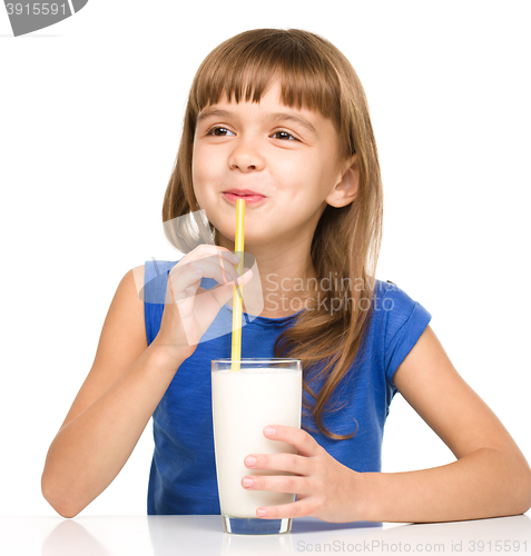 Image of Cute little girl with a glass of milk