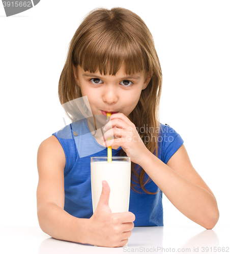 Image of Cute little girl with a glass of milk