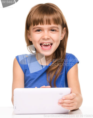 Image of Young girl is using tablet