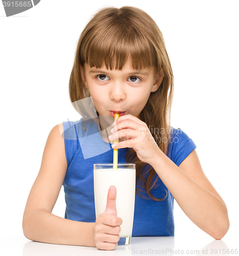 Image of Cute little girl with a glass of milk