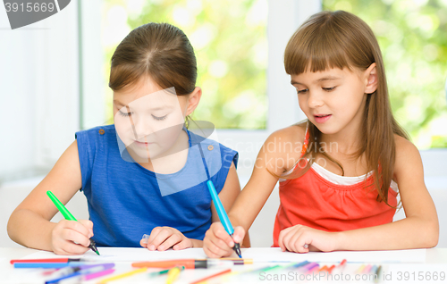 Image of Little girls are drawing using felt- tip pens