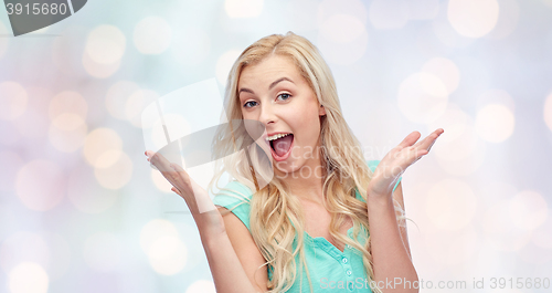 Image of surprised smiling young woman or teenage girl