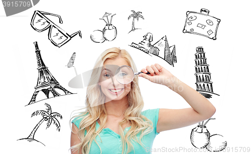 Image of happy young woman with magnifying glass