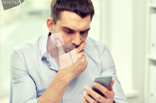 Image of close up of businessman with smartphone