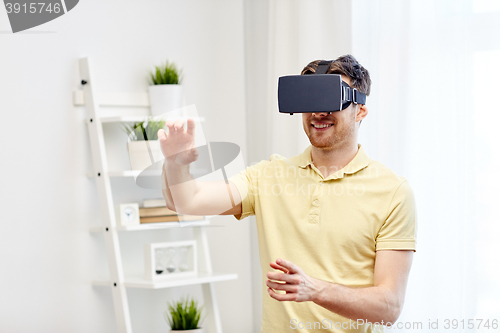 Image of young man in virtual reality headset or 3d glasses